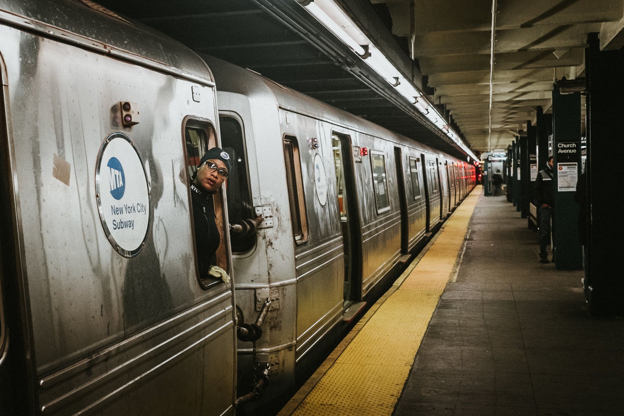 Image of commuters on a subway.