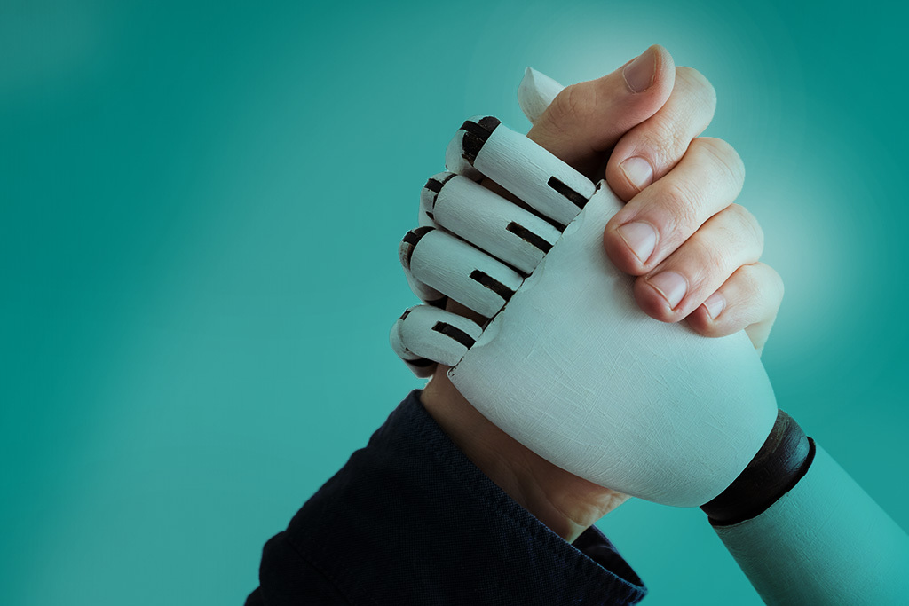 human hand an robot hand clasped for arm wrestling